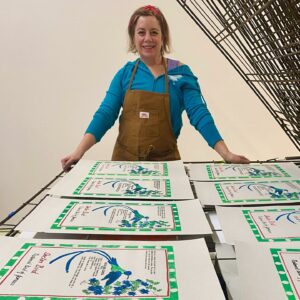 Printing student with prints.