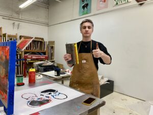 Young man showing his work