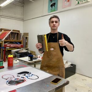 Young man showing his work